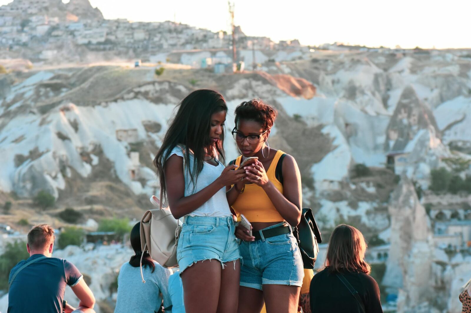 two women looking at phone