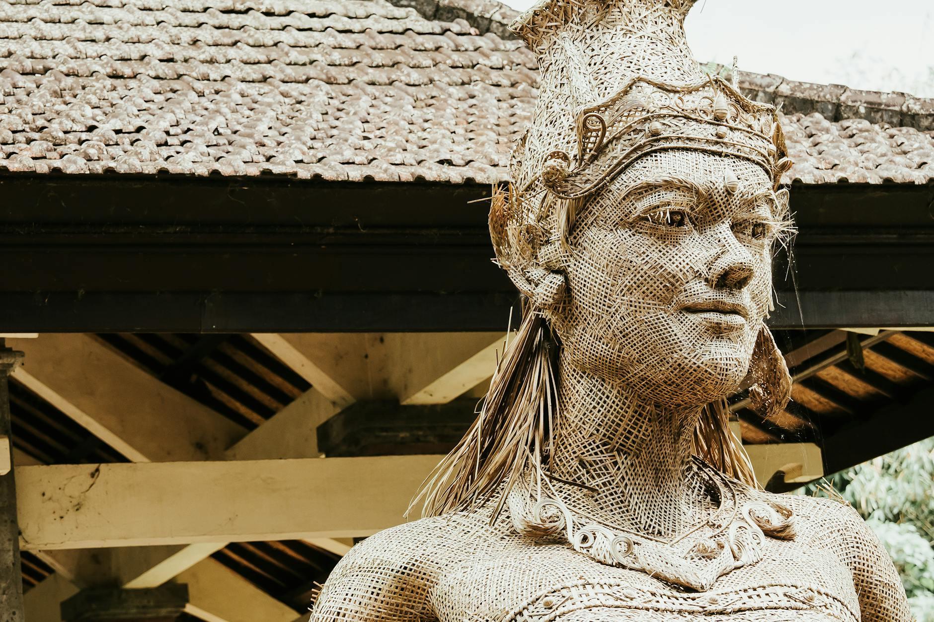 a statue of a woman with a headdress